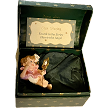Harriet in her treasure chest box with place card tag 